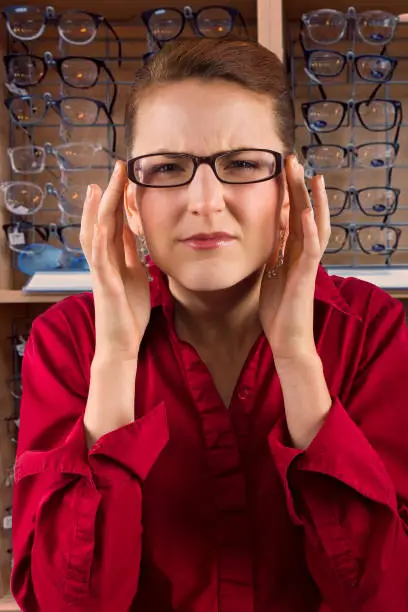 woman choosing prescription eyeglasses