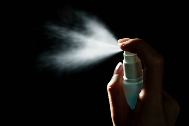 istock Hand using sanitizer spray, alcohol spraying disinfectant to stop spreading  coronavirus or COVID-19. 1217932652