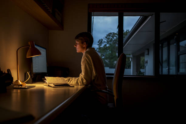 istock Women working on her computer early in the morning 1217936418