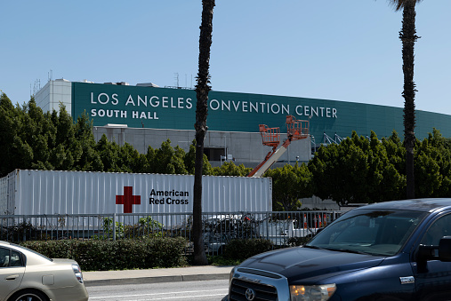 Los Angeles, CA/USA - April 1, 2020: Red Cross trucks lined up at the Los Angeles Convention Center which has become a field hospital for coronavirus cases