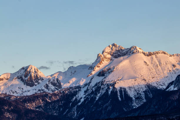 istock Sunlit Triglav peak from Bohinj valley, early light 1217940500