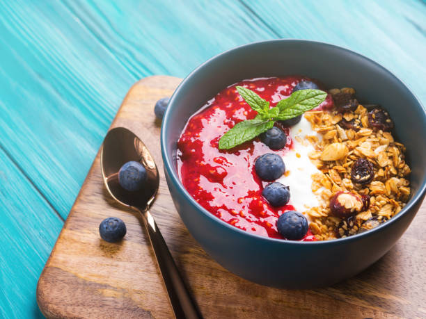 istock Yogurt smoothie bowl with blended raspberries 1217943333