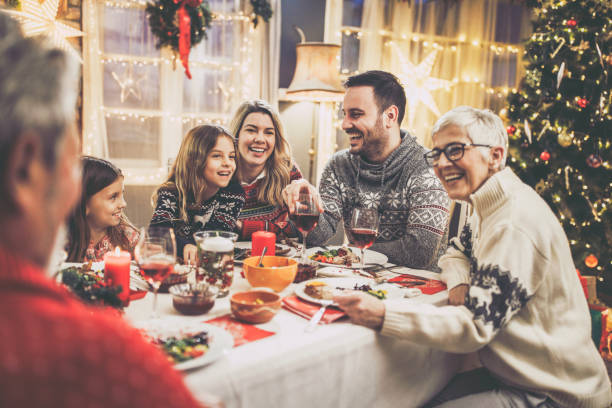 istock Family's New Year's Eve at dining table! 1217946018