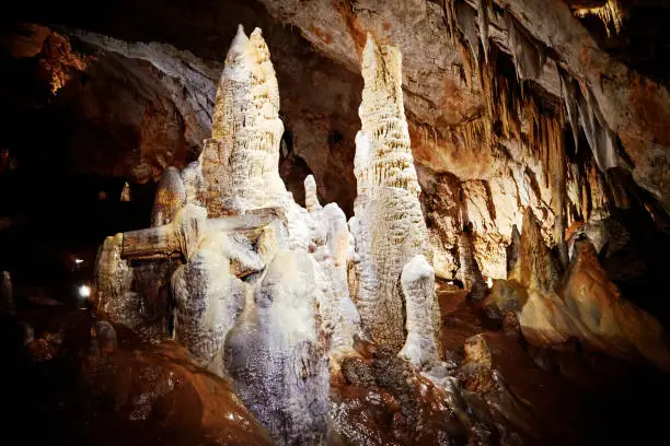 Photo of Stalactites and stalagmites deep underground in the famous Lipa Cave in Montenegro. Natural backgrounds