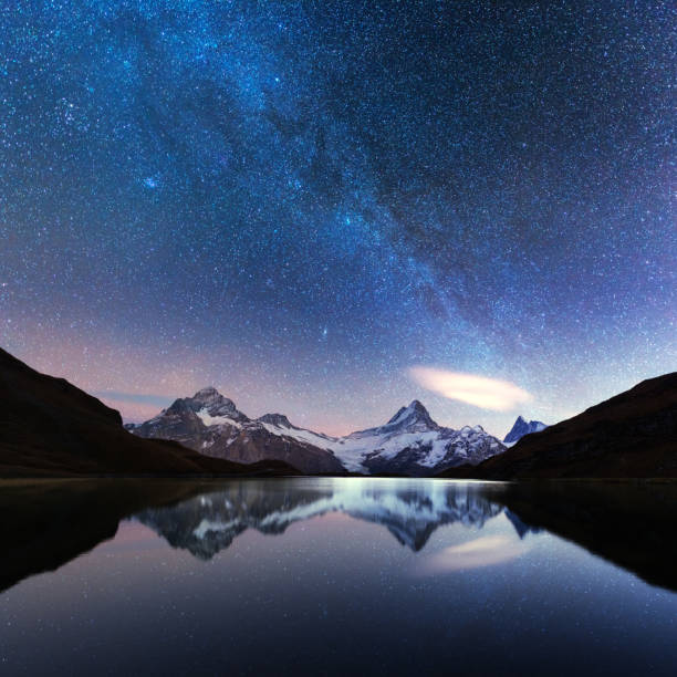 Incredible night view of Bachalpsee lake Incredible night view of Bachalpsee lake in Swiss Alps mountains. Snowy peaks of Wetterhorn, Mittelhorn and Rosenhorn on background. Grindelwald valley, Switzerland. Landscape astrophotography grindelwald photos stock pictures, royalty-free photos & images