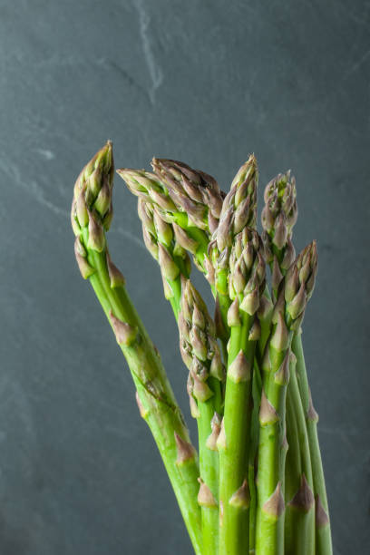 istock tips of green asparagus in a bundle 1217949223