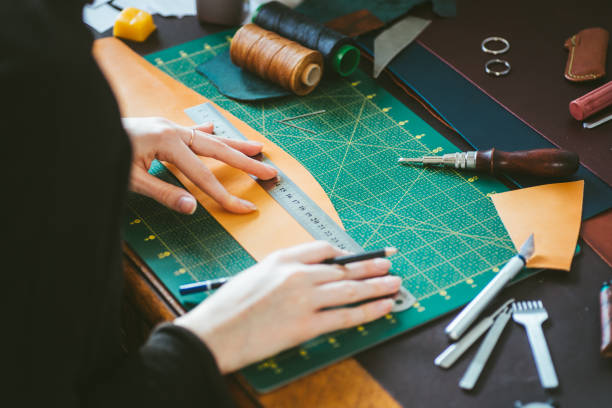 istock Woman marking on leather 1217949242
