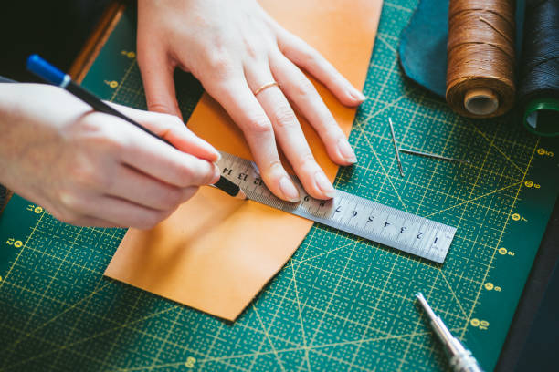 istock Woman marking on leather 1217949253
