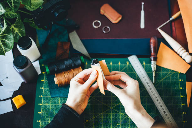 istock Woman working with leather 1217949256