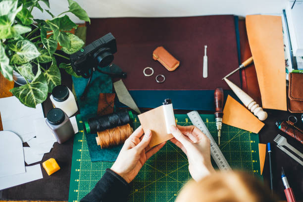 istock Woman working with leather 1217949266