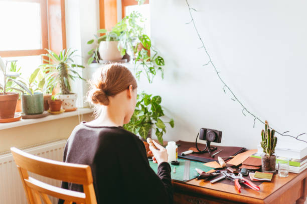 istock Woman sitting behind a desk 1217949272