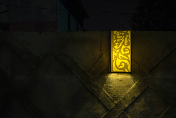 Yellow outdoor lamp in night time