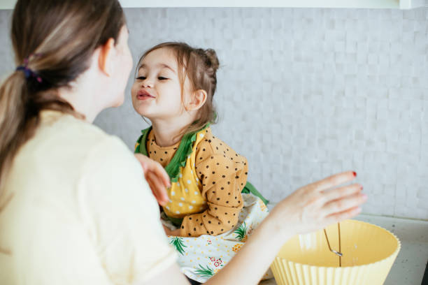 istock Mother and daughter baking stock 1217954518