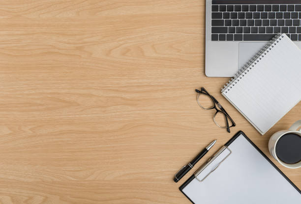 istock Top view Wood office desk table. Flat lay Workspace 1217956202