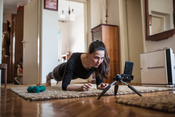 istock Woman home exercising 1217957259