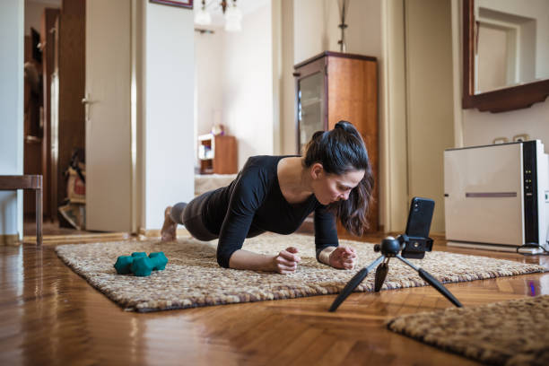 istock Woman home exercising 1217957365