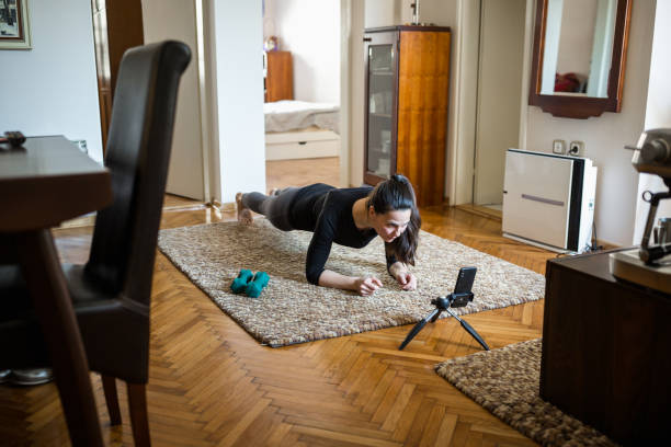 istock Woman home exercising 1217957394