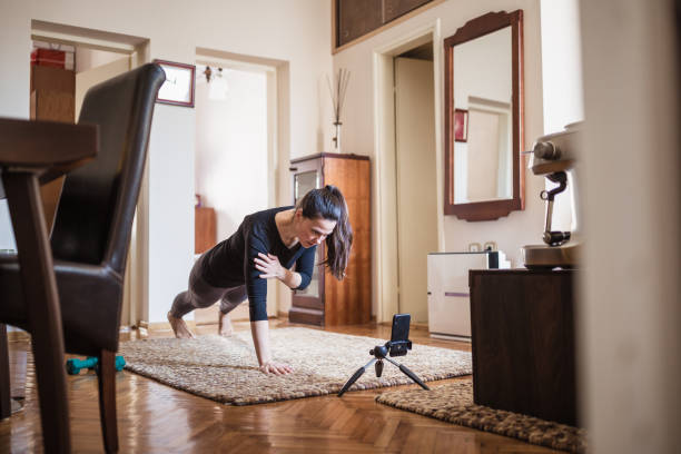 istock Woman home exercising 1217957459