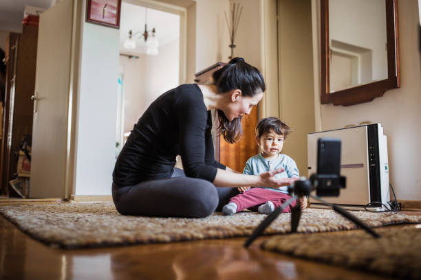 istock Woman home exercising with her baby 1217957511