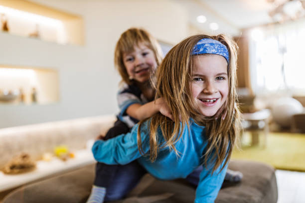 istock Playful little brothers having fun at home. 1217958445