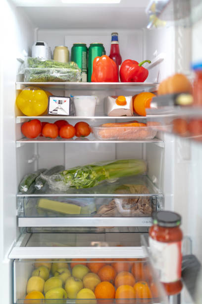 istock Refrigerator filled with vegetables, fruit and other items 1217959052
