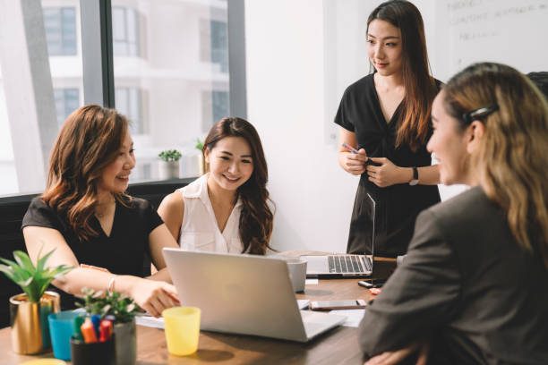 istock business people using laptop in meeting room office 1217959714