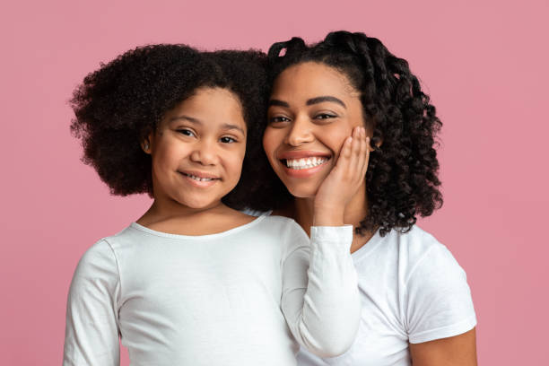 istock Single Black Mom Posing To Camera With Her Cute Little Daughter 1217961021