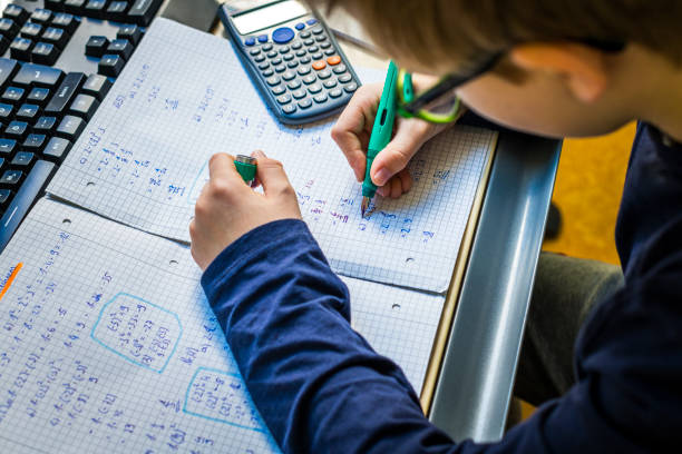 istock teenager doing homework in his room 1217962681