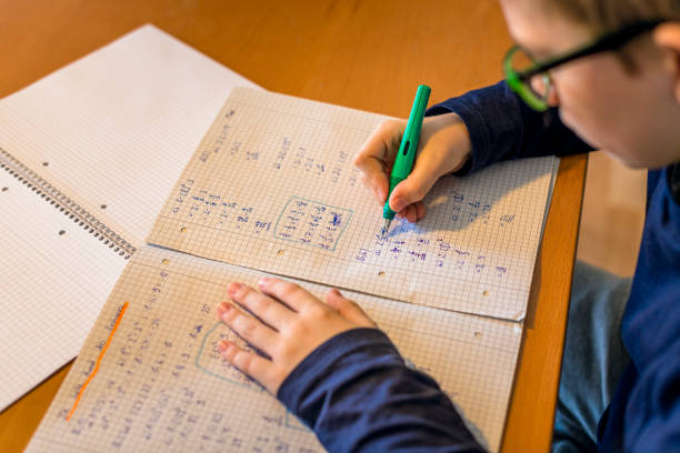istock teenager doing homework at dining table 1217962909