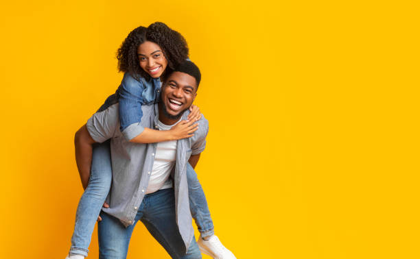 istock Romantic African American Man Guy Piggybacking His Cheerful Girlfriend 1217962937