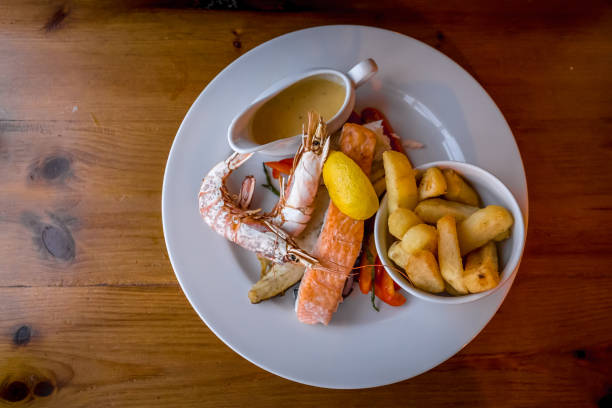 istock Fried seafood on a plate in pub, UK 1217963719