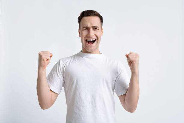 istock Happy man rejoices and celebrating winning, copy space 1217963923
