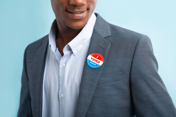 istock Man putting on Vote button for Presidential election 2020 1217964989