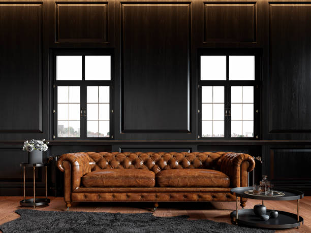 Classic loft black interior with wood panel, chesterfield couch, carpet, flowers, coffee table and windows. 3d render illustration mock up. Classic loft black interior with wood panel, chesterfield couch, carpet, flowers, coffee table and windows. 3d render illustration mock up. leather couch stock pictures, royalty-free photos & images