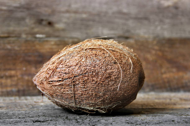 istock Coconut on a wooden background. Coconut close up 1217965471
