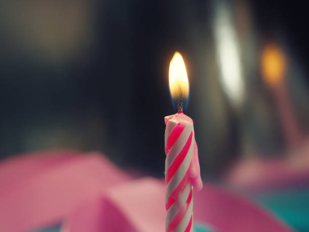 istock Burning Birthday Candle Cake On A color Background. 1217965674