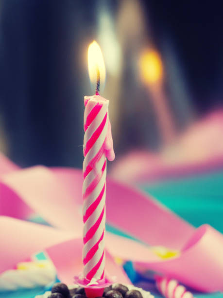 istock Burning Birthday Candle Cake On A color Background. 1217965678