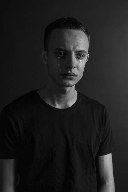 istock Black and White Emotional Portrait Young Man 1217966699