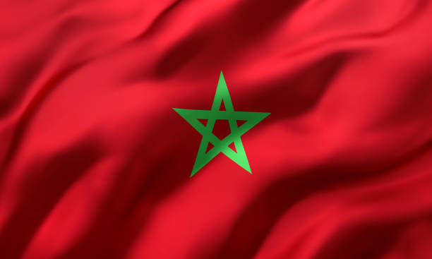 istock Flag of Morocco blowing in the wind 1217966900