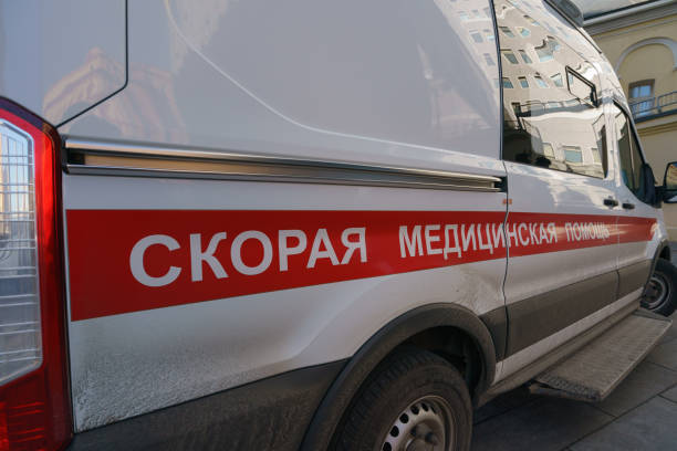 Ambulance car Moscow, Russia - March 25, 2020: Modern ambulance car at the spring city street. Tranlation of inscription - Emergency medical services.  Coronavirus Pandemic lifestyle of the big city. ambulance stock pictures, royalty-free photos & images