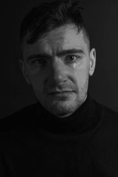 istock Black and White Emotional Portrait Young Man 1217968290