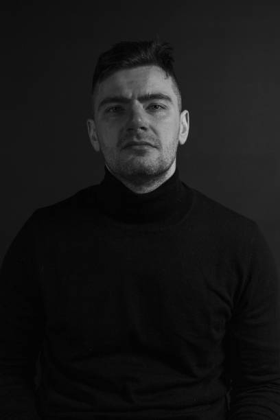 istock Black and White Emotional Portrait Young Man 1217968302