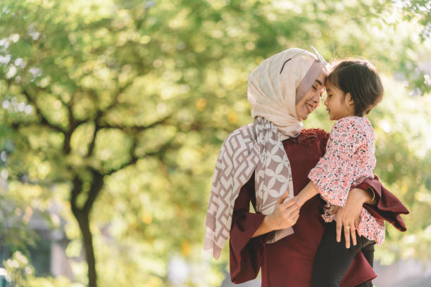 istock young asian malay mother carrying daughter 1217968429