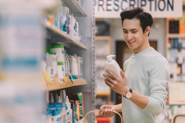 istock asian chinese browsing medicine supplements at pharmacy store 1217968582