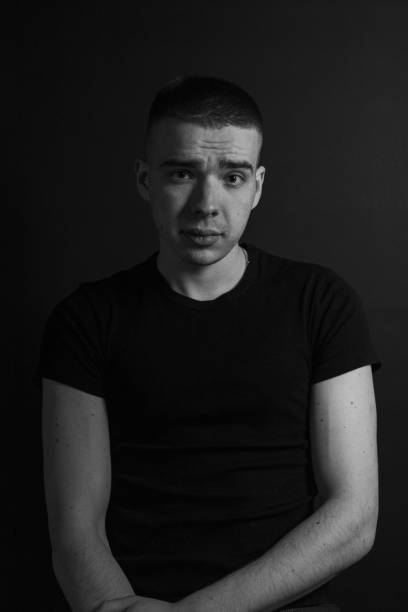 istock Black and White Emotional Portrait Young Man 1217969277