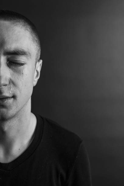 istock Black and White Emotional Portrait Young Man 1217969472