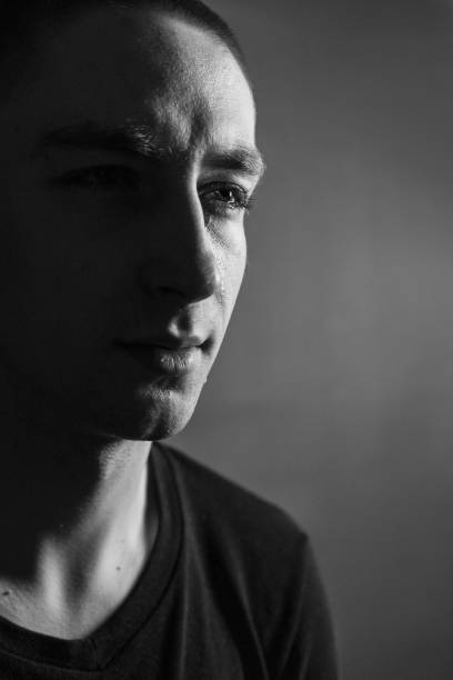 istock Black and White Emotional Portrait Young Man 1217969503