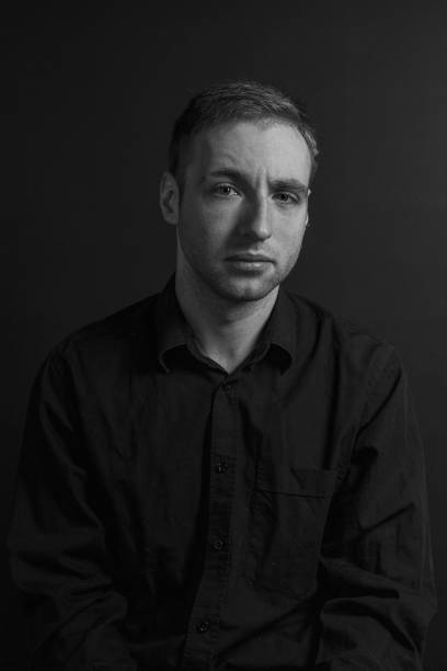 istock Black and White Emotional Portrait Young Man 1217969972