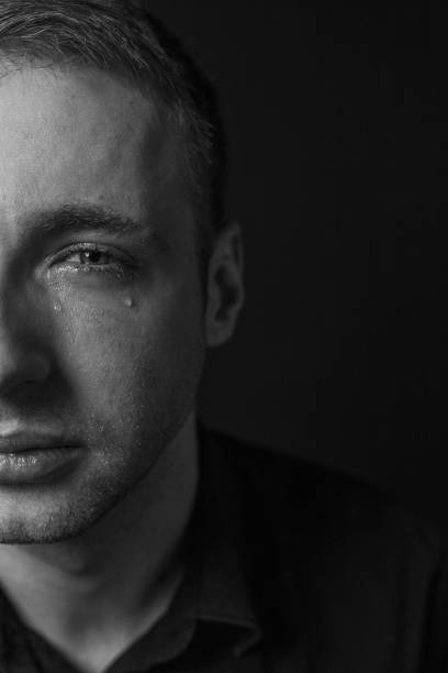 istock Black and White Emotional Portrait Young Man 1217969973