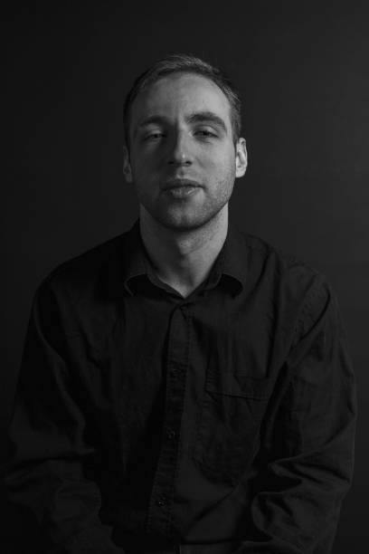 istock Black and White Emotional Portrait Young Man 1217970003
